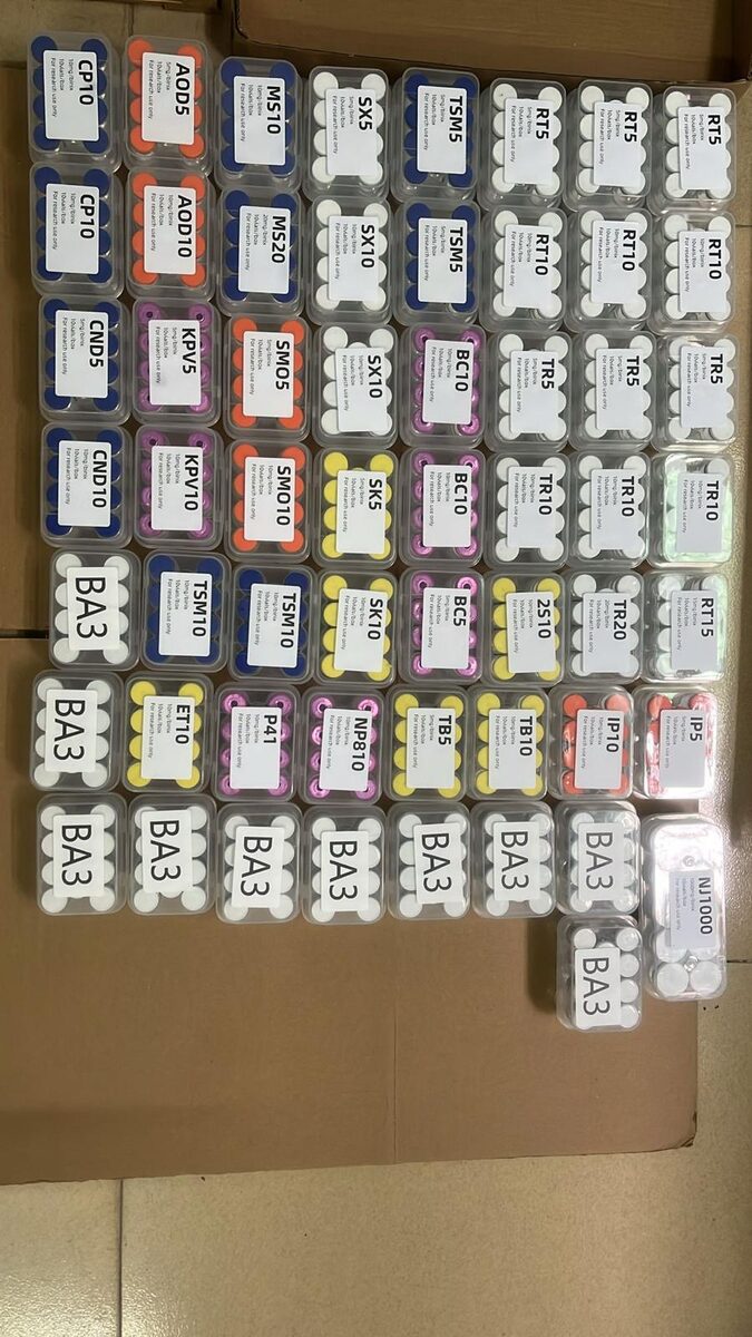 Research peptide vials with colour-coded flip caps